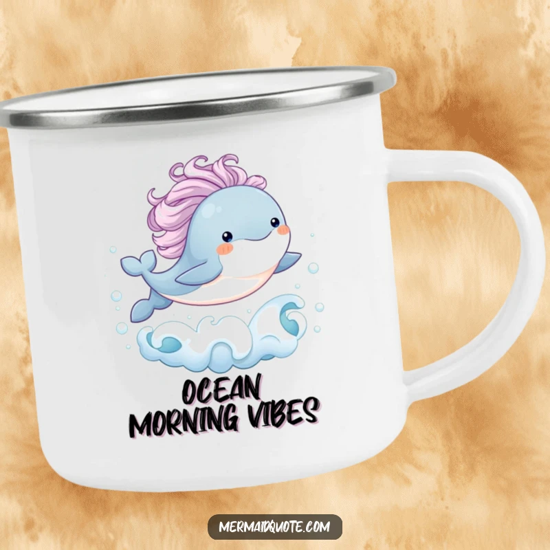 Funny enamel camping mug showing a baby whale with a flowing mane joyfully leaping from bubbly ocean waves, ideal for enjoying beverages outdoors with whimsical humor.