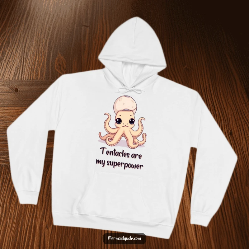 Funny octopus hoodie depicting a content sea creature with a tower of seashells balanced on its many arms, perfect for chilly days.