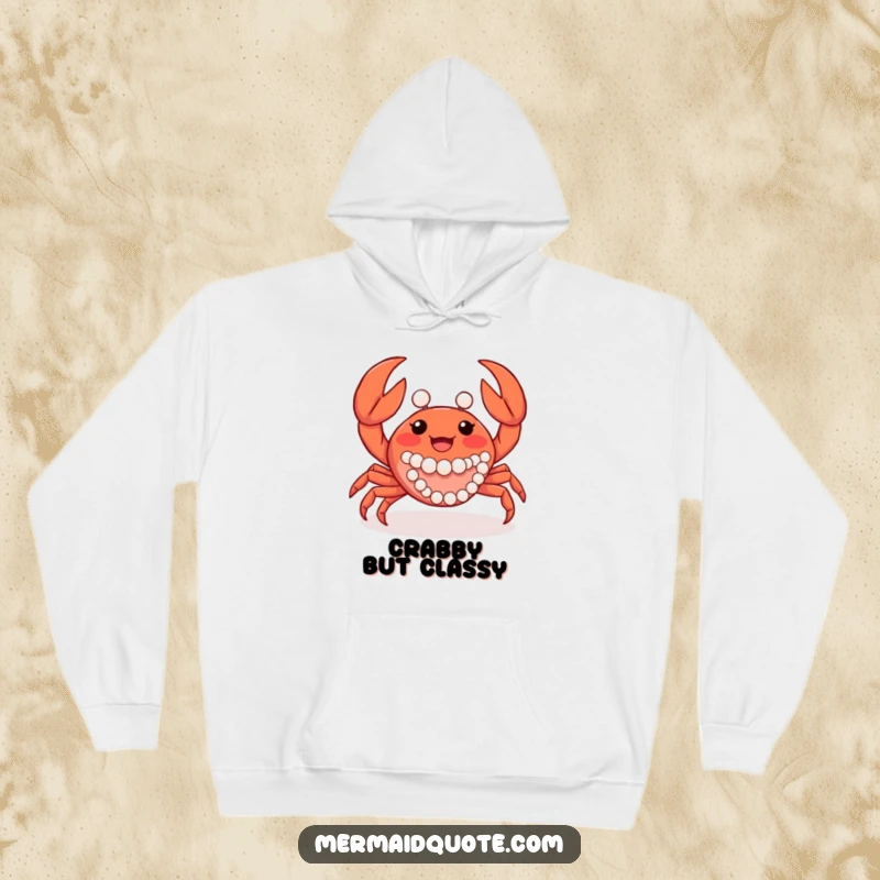 Funny joyful crab creature waving its claws, adorned with pearls, featured on a comfortable and humorous hoodie.