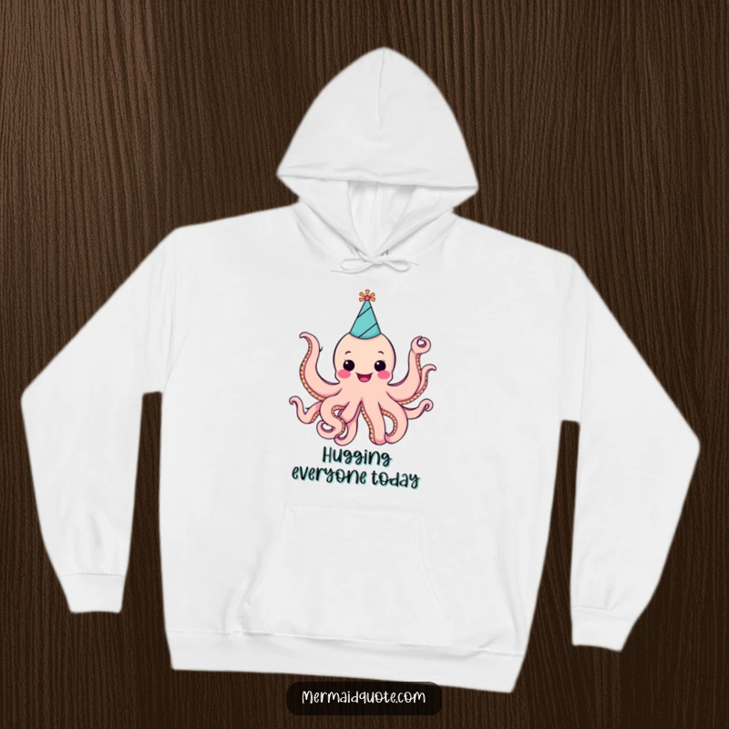 Funny cheerful octopus wearing a party hat, energetically waving all eight arms, depicted on a warm and soft hoodie.