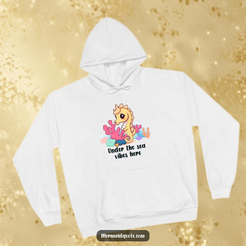 Funny seahorse hoodie showing a curious seahorse peeking from behind lush coral, a warm and humorous depiction of marine life.