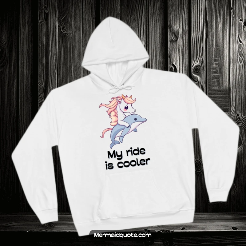 Funny hoodie depicting a cute seahorse with a majestic mane riding a dolphin, perfect for cozying up with a touch of ocean humor.