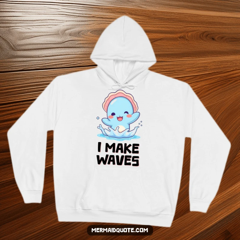 Funny hoodie featuring a kawaii blue creature with a seashell hat, splashing water playfully, offering warmth and cheerful vibes.
