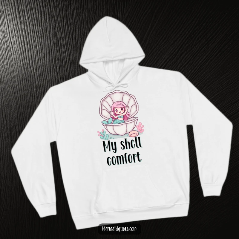 Funny hoodie depicting a mermaid waving from inside a giant clam, cozy and whimsical.