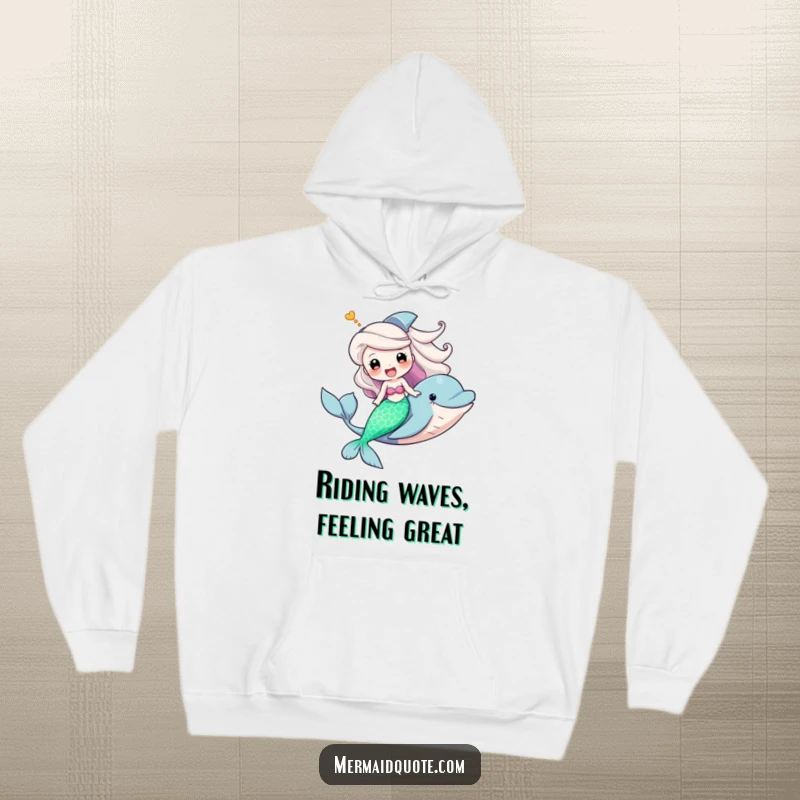 Funny hoodie showcasing a triumphant mermaid riding a friendly dolphin, radiating fun and a sense of grand ocean adventure.
