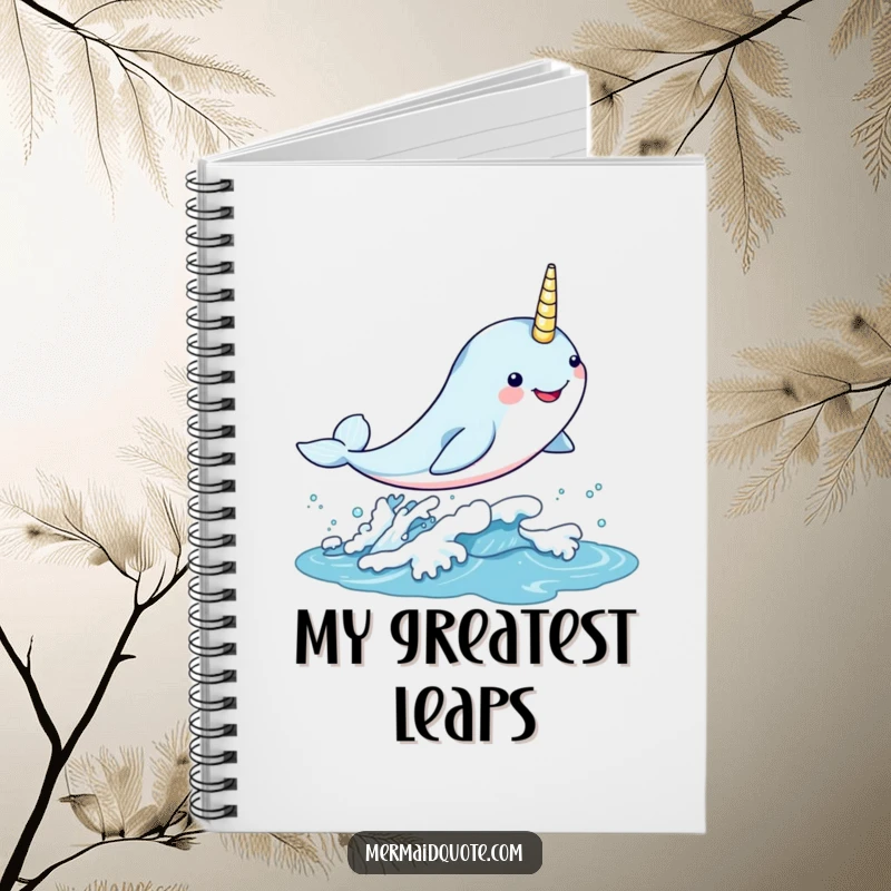 Funny kawaii narwhal leaping gleefully through a shimmering wave on a notebook, great for jotting down magical ideas.