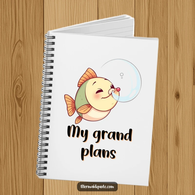 Funny fish notebook with a cover illustration of a determined little fish blowing a large, perfect bubble, ideal for writing and sketching.