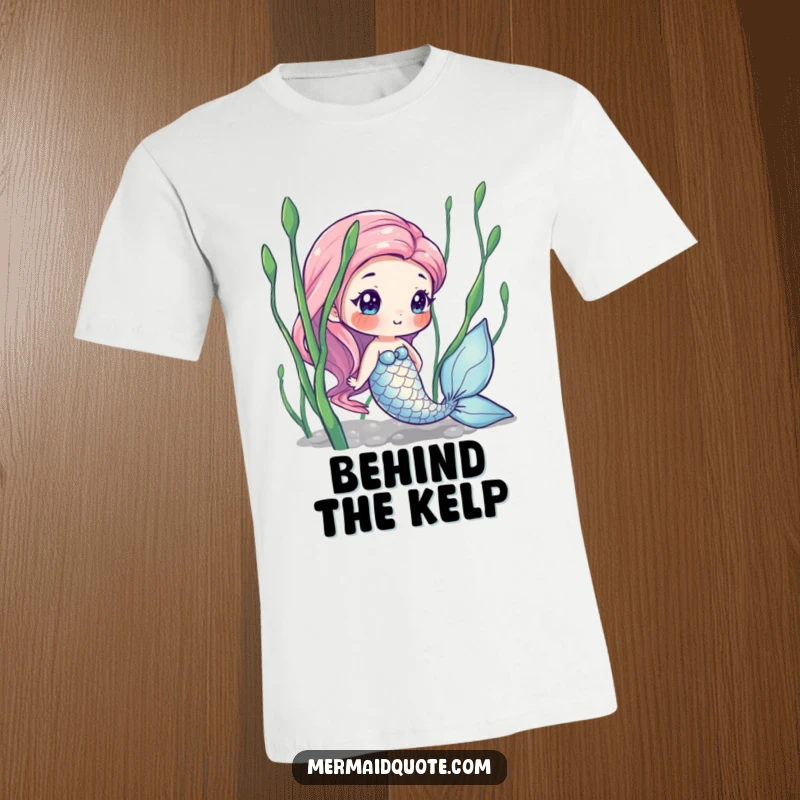 Funny t-shirt with a curious mermaid hiding behind seaweed, showcasing iridescent scales and a playful, mysterious underwater vibe.