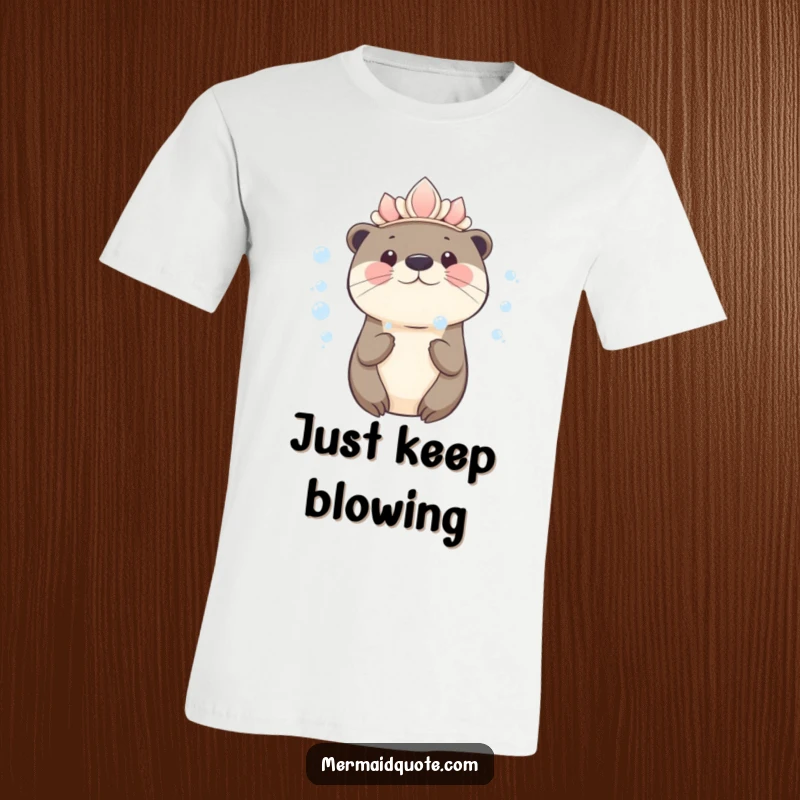 Funny kawaii otter wearing a seashell crown blowing bubbles on a t-shirt, adorable and playful graphic for all ages.