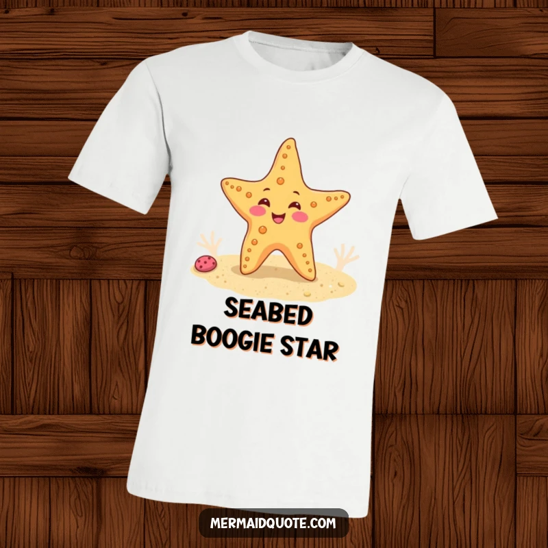 Funny T-shirt depicting a cheerful starfish performing a cute wiggle dance on a sandy seabed, full of underwater glee.