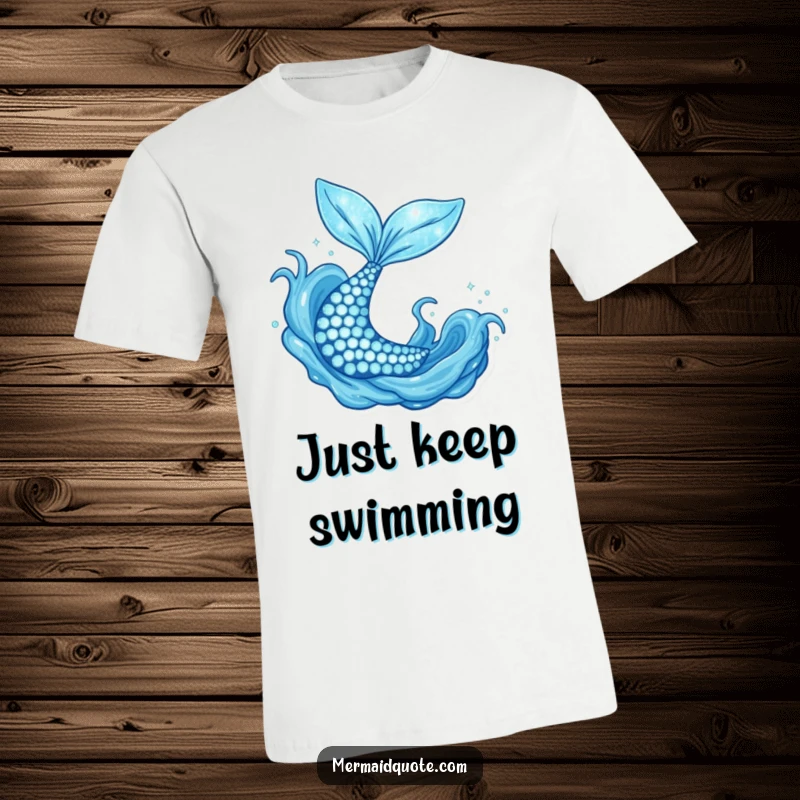Funny sparkly mermaid tail flipping joyfully in blue water, a whimsical t-shirt for ocean lovers.