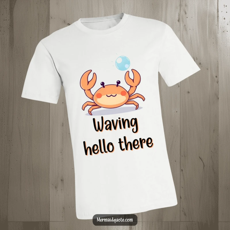 Funny tiny crab playfully waving its tiny claws at a bubble, a whimsical t-shirt for beach lovers.