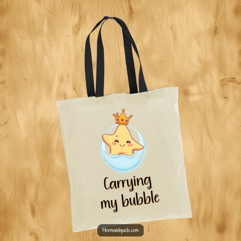 Funny tote bag with a smiling starfish wearing a crown, floating on a bubble, perfect for carrying essentials with regal charm.
