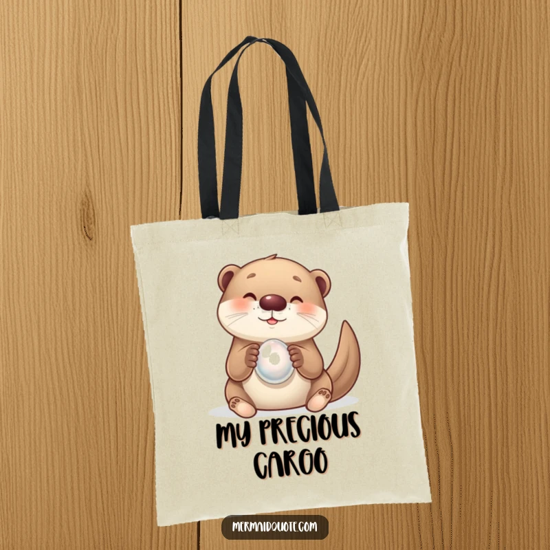Funny tote bag with a curious otter creature excitedly holding a sparkling pearl. Great for carrying items whimsically.